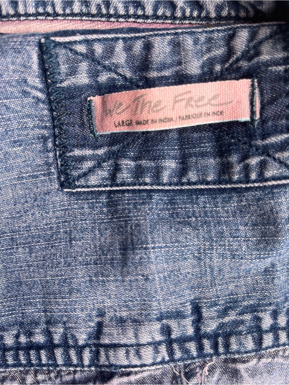 We The Free faded blue denim (with pinkish hue) top